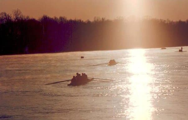 Multiple rowing shells silhouetted on the Tennessee River at sunset, late 1990s.