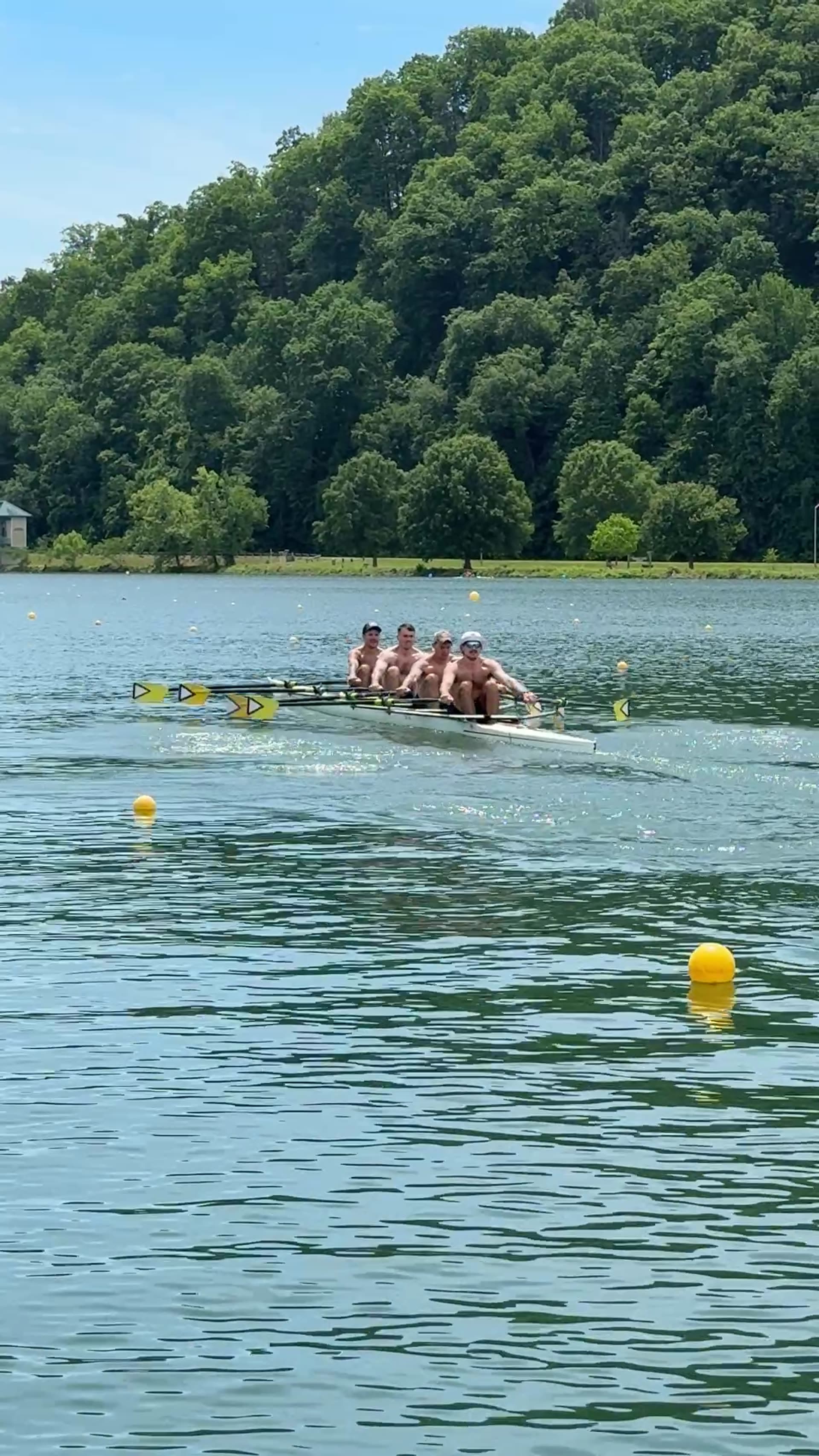 UTC Rowing's 2026 men's quad on the race course in ACRA preparation, distant view of the full lane.
