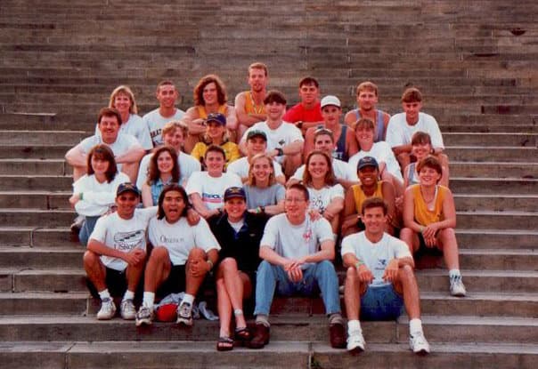 UTC Rowing team group photo on stadium-style steps — approximately 25 men and women