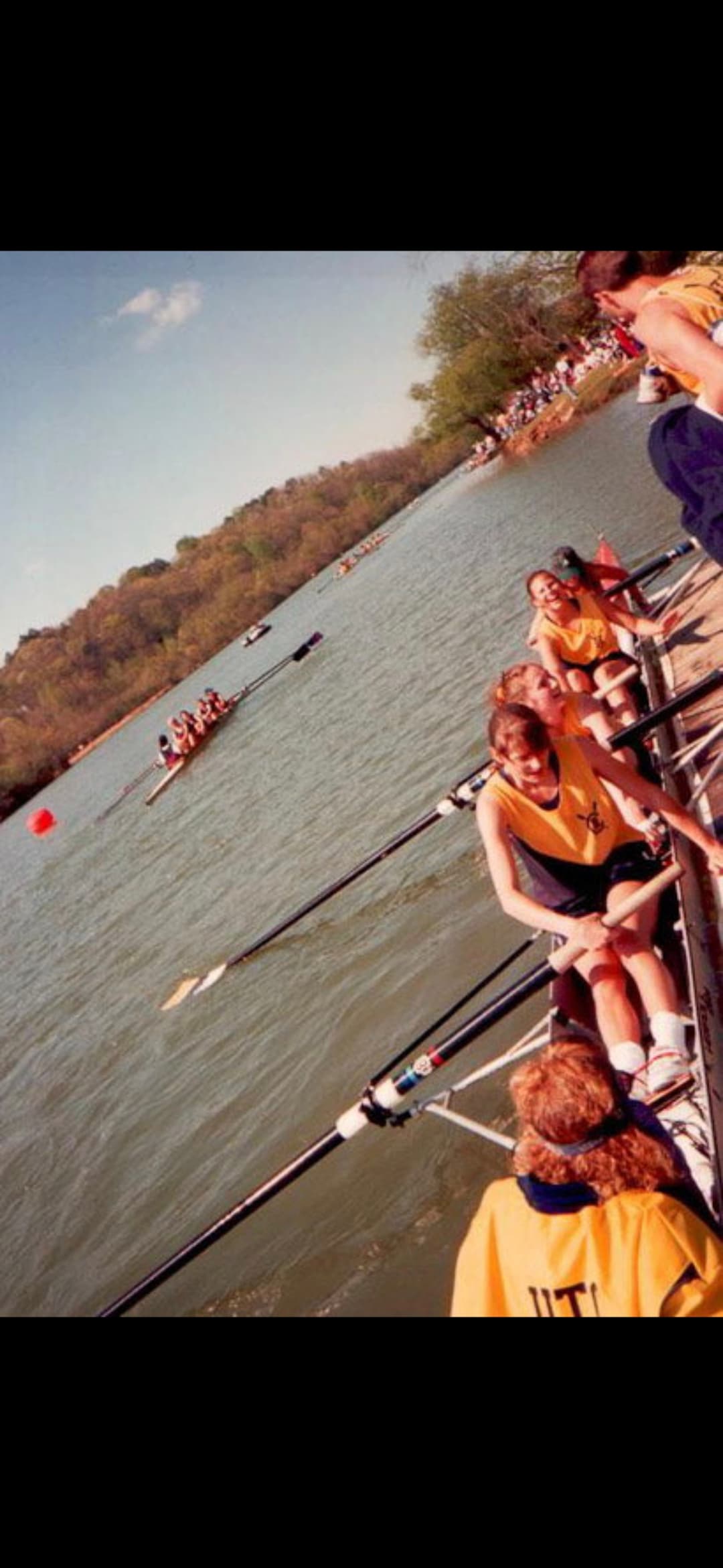Race-start view from inside a UTC boat (start-line buoys, other crews lined up)